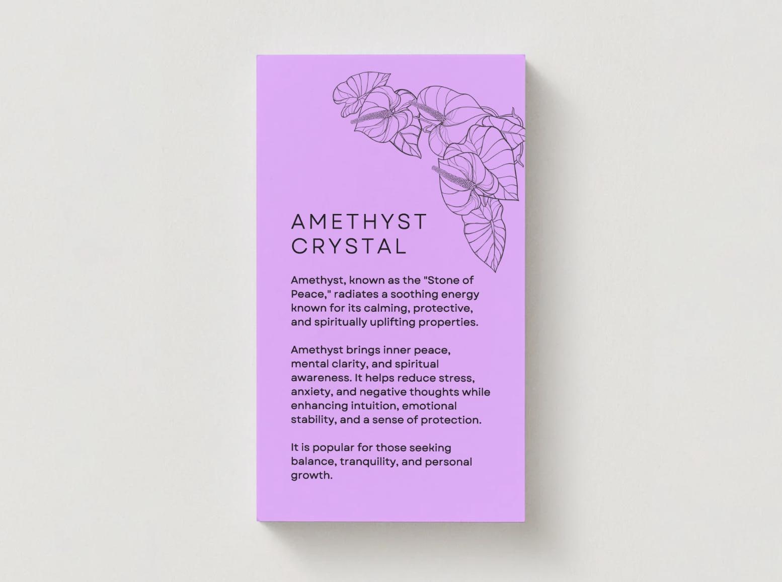 amethyst crystal meaning written on a purple card on grey background.