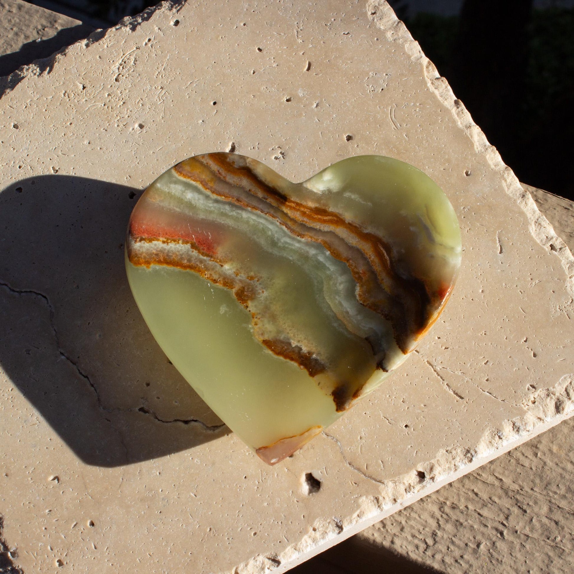 green heart dish with red patterns.