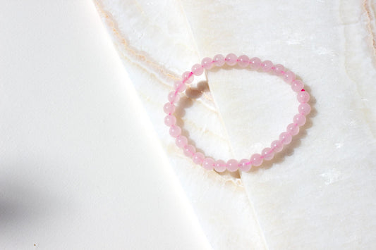 rose quartz beaded stretch bracelet pink string.
