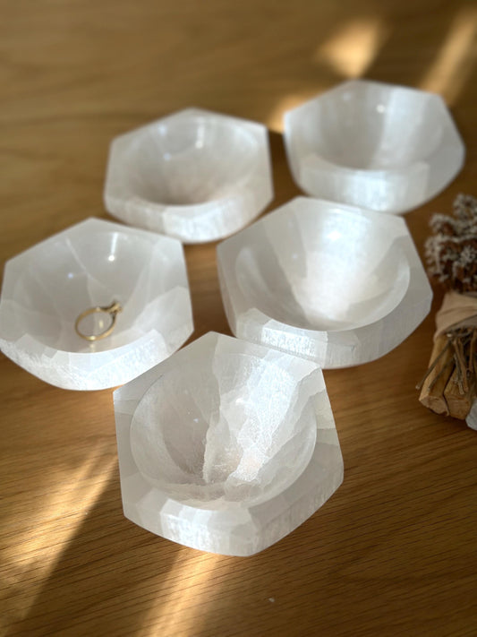 group of white crystal hexagon bowls.