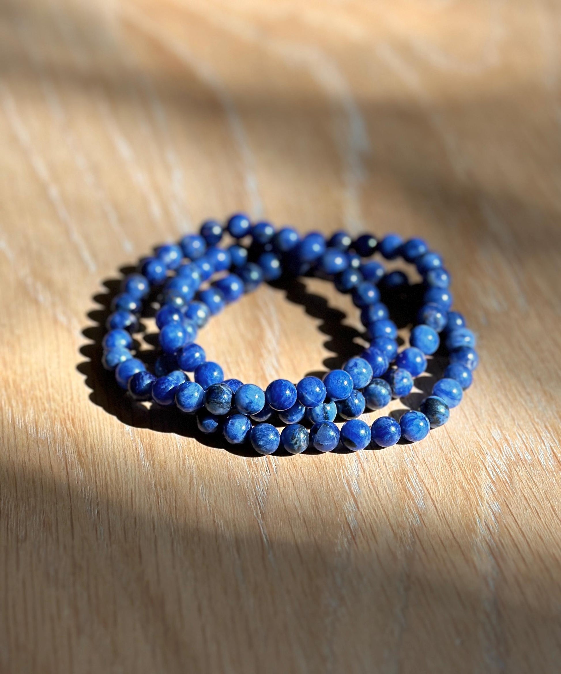 group of blue crystal bracelets in sodalite.