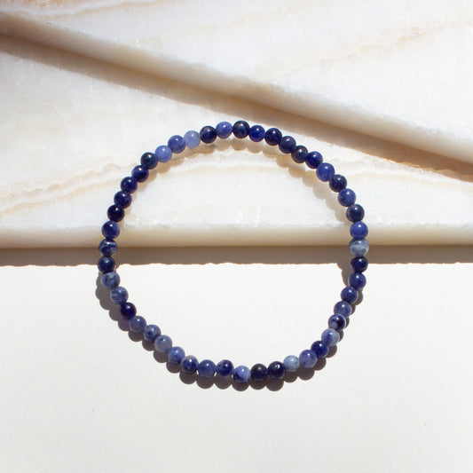 sodalite blue crystal beaded bracelet on a light background.