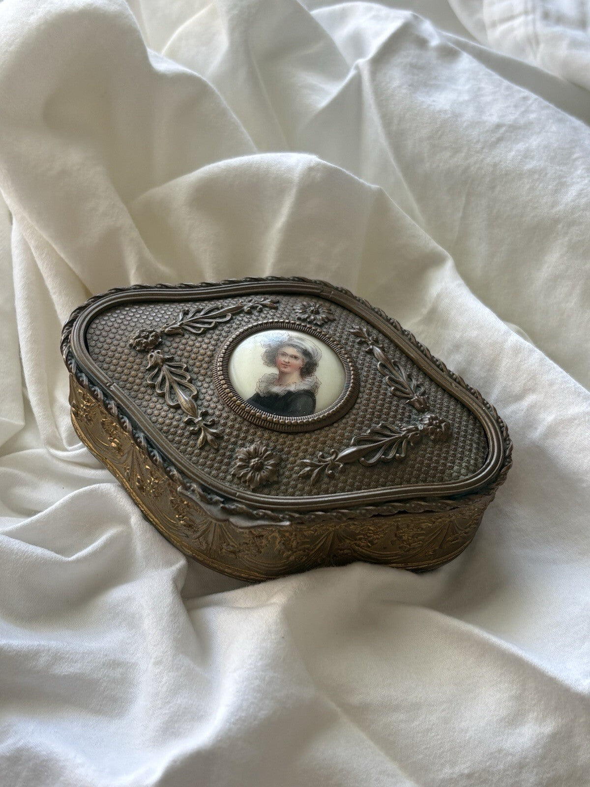 Rococo gilt brass trinket box with floral garlands