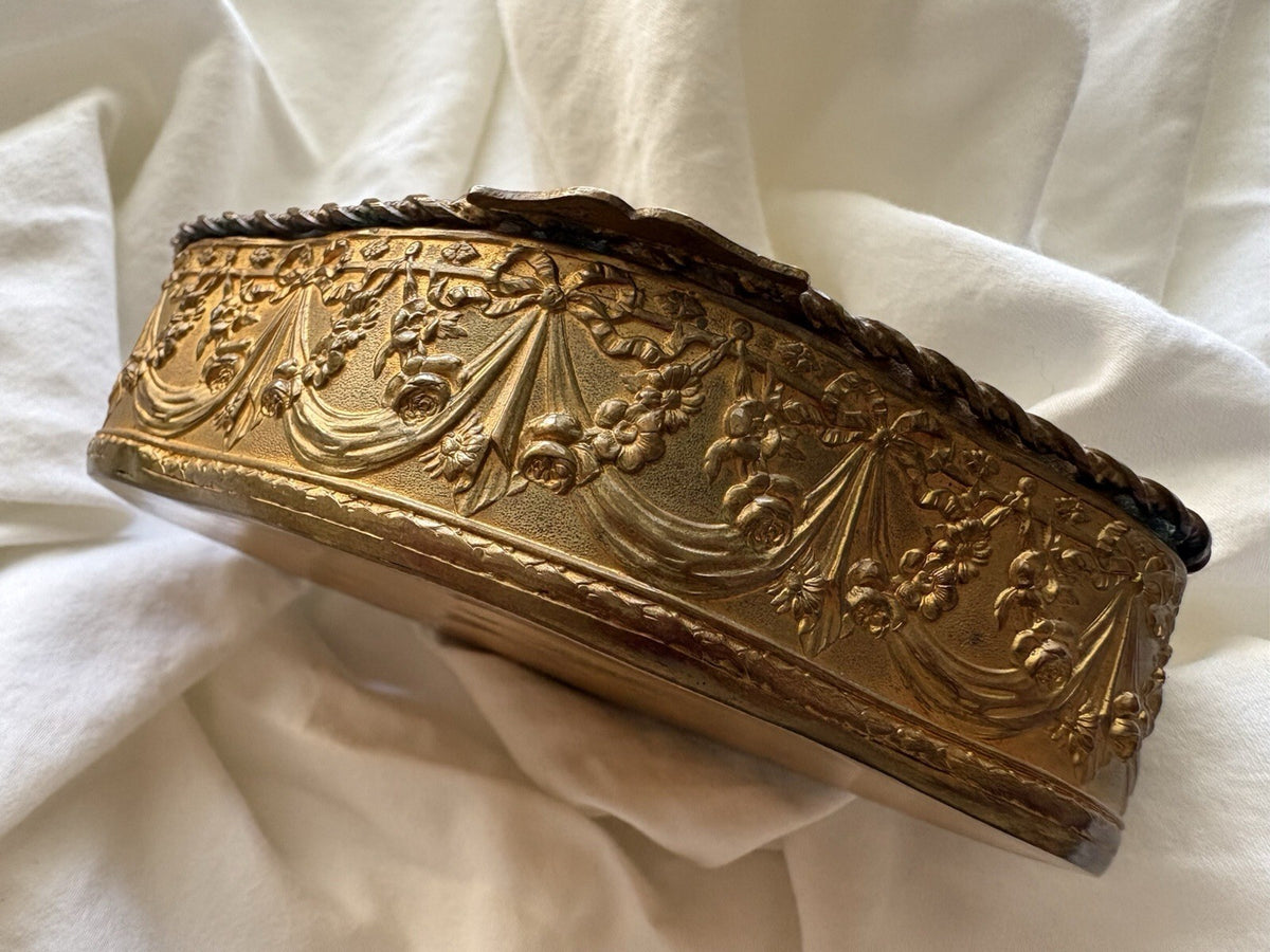 Rococo gilt brass trinket box with floral garlands