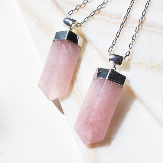 large rose quartz necklace pendant on silver chain. 